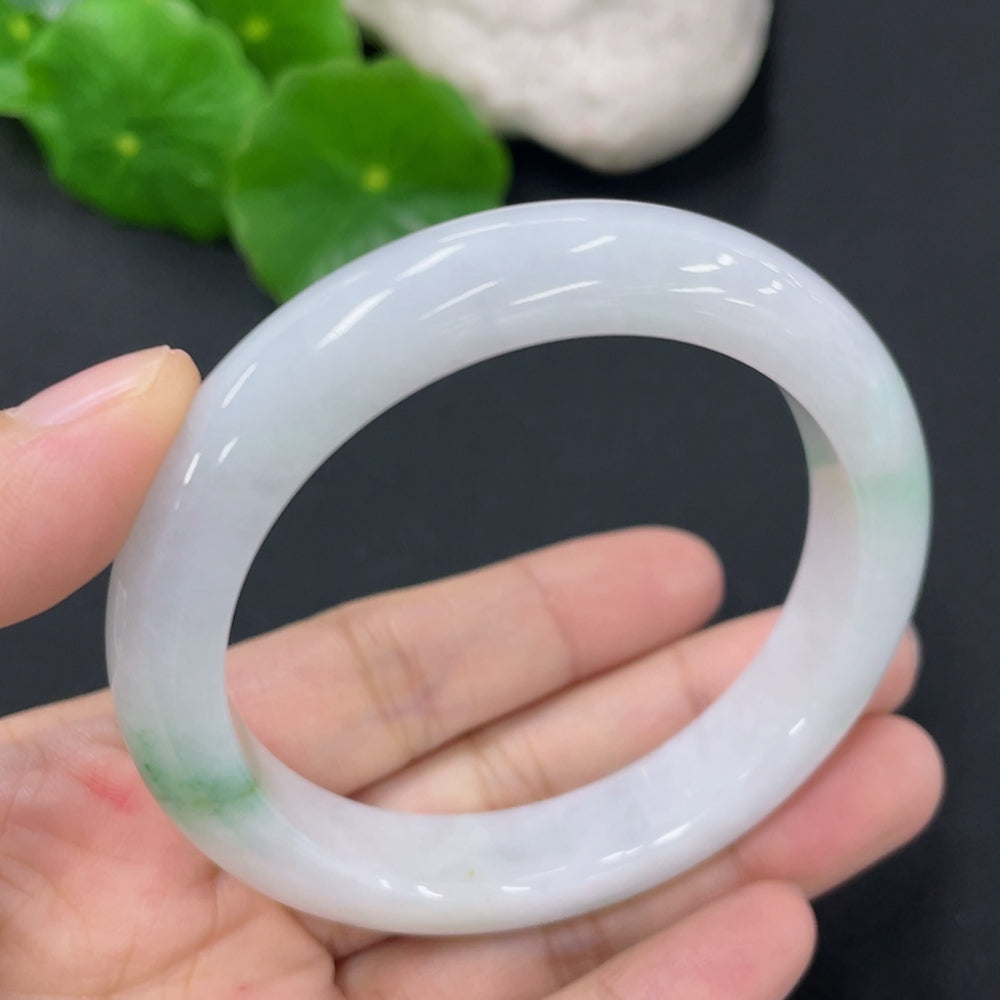Jadeite round bangle with a weight of 46g and size 52.5, showcasing smooth, polished jadeite in a natural, glossy finish.