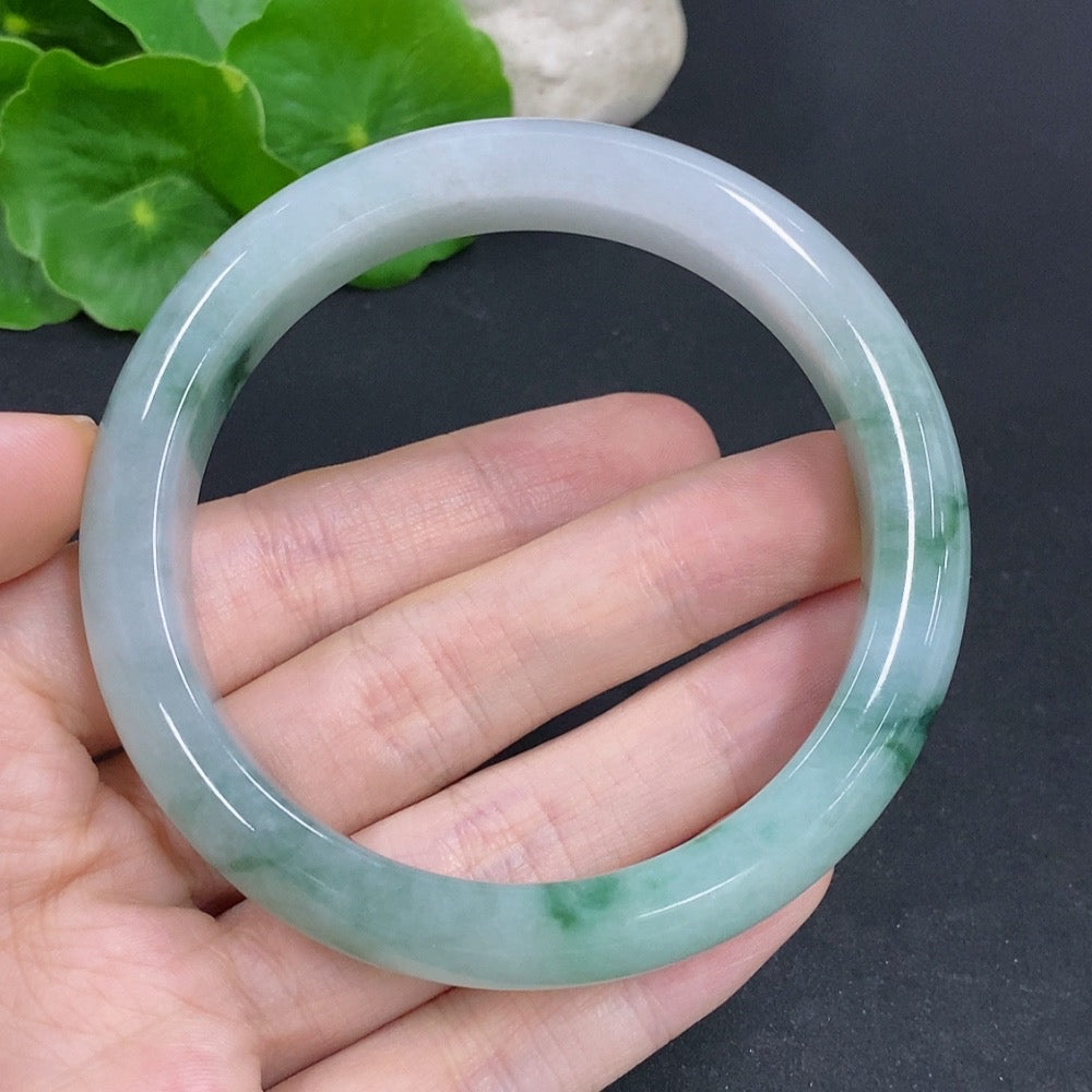 Jadeite round bangle with a smooth finish, weighing approximately 65.6g, size 60, from HKHQ.
