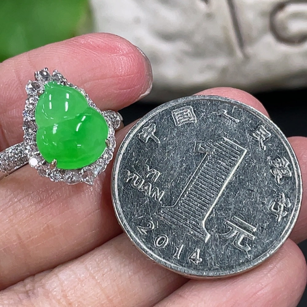 Jadeite gourd ring with 18K gold setting and diamond accents, crafted by HKHQ, displayed on a white background.