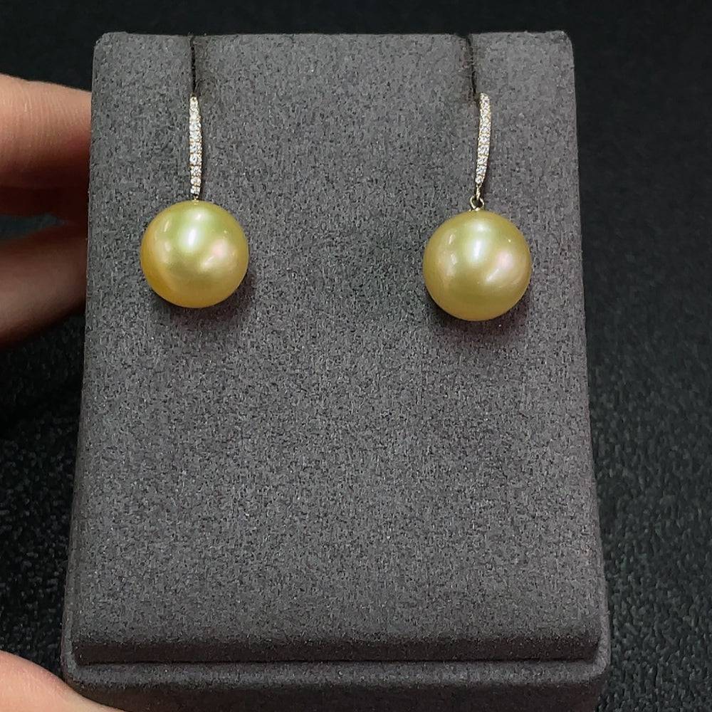 Huiliu certified seawater pearl earrings with 11.6mm round pearls in natural color, featuring Au58% content and elegant design.