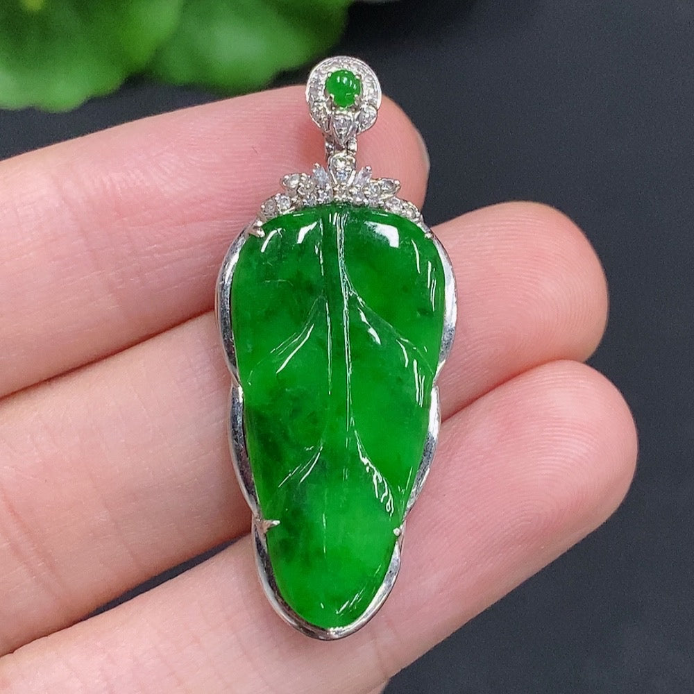 Jadeite leaf pendant with diamond accents, 18k gold, designed by HUILIU HQ, weighing approximately 4g, featuring detailed leaf shape.