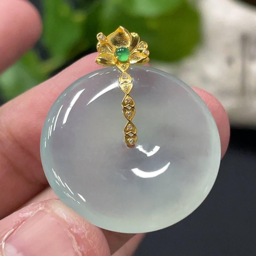 Jadeite safety pendant with 18K gold bail and diamond accents, weighing approximately 6.87g, from HUILIU HQ.