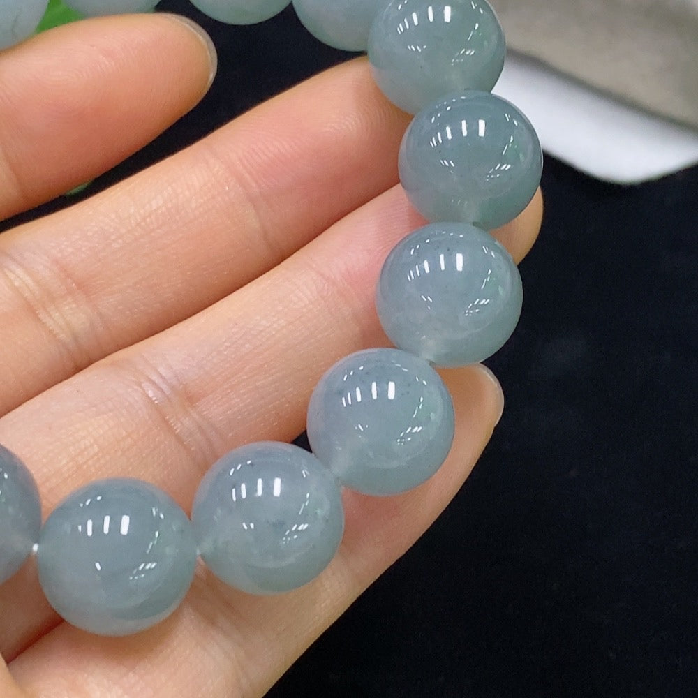 Jadeite bracelet with 13mm jade beads, weighing approximately 58.13 grams, by HUILIU HQ, featuring smooth, polished jade stones.
