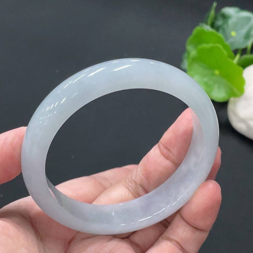 Jadeite round bangle from HUILIU HQ, 56g weight, size 57.9mm, showcasing smooth, polished jadeite surface and rich green color.