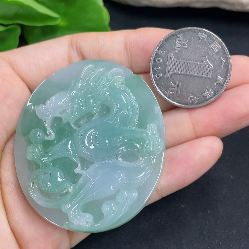 Jadeite dragon pendant necklace from HKHQ, showing a detailed green jadeite dragon carving on a chain.