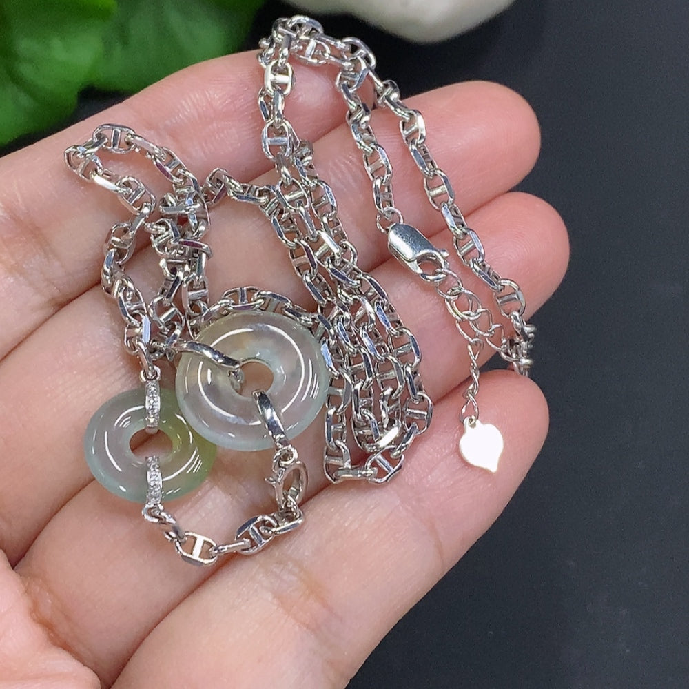 Jadeite safety buckle necklace by HUILIU HQ featuring 18K gold and diamond accents, with a jade pendant and secure clasp.