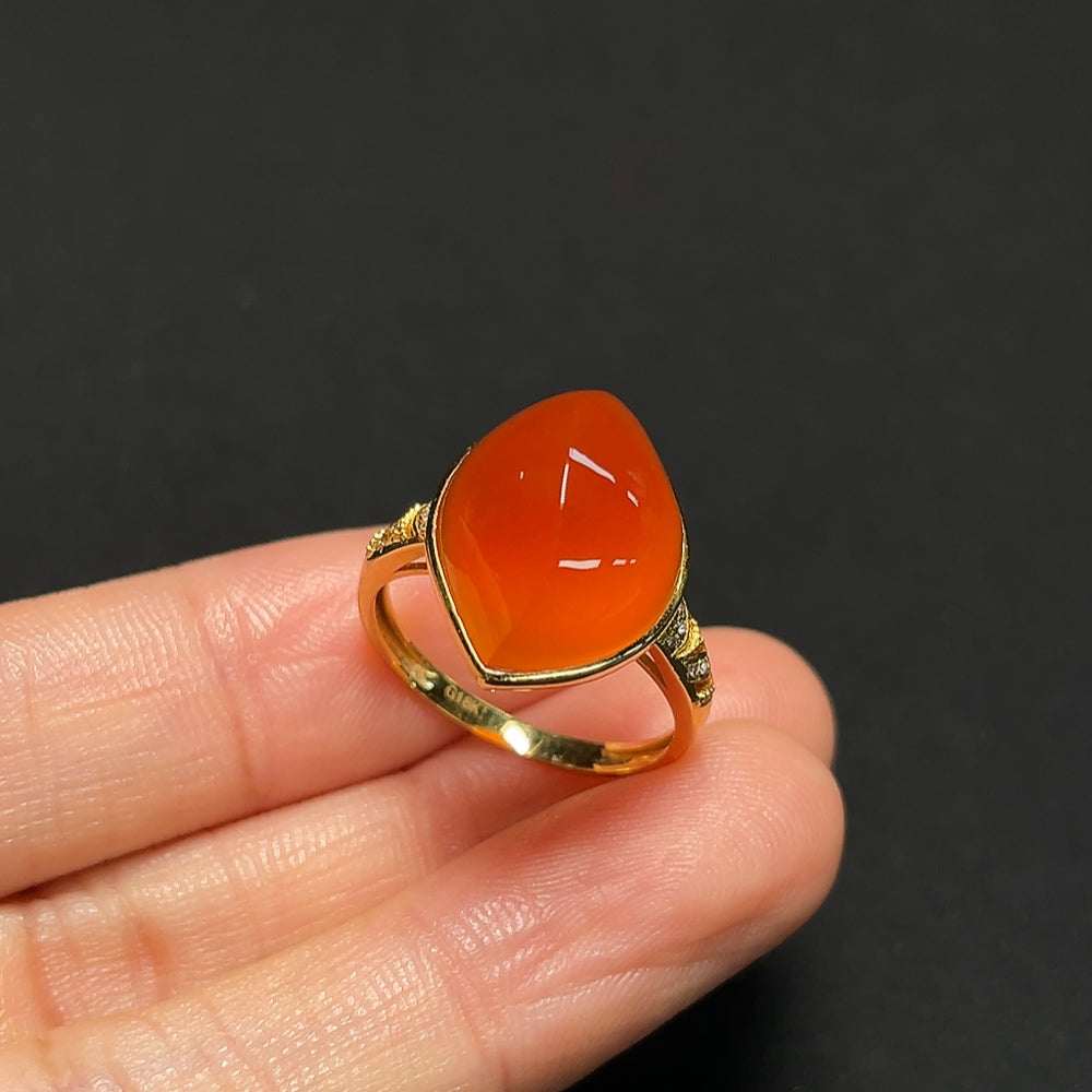 18K gold ring featuring a Southern Red Agate gemstone with diamond accents, designed by HKHQ.