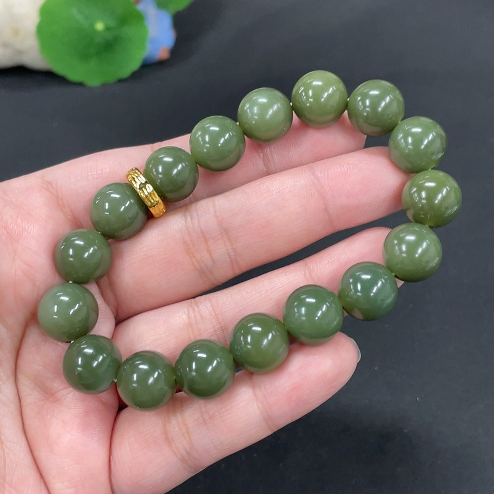 Huiliu certified Hetian jade bracelet with 12mm smooth, non-porous jade beads showcasing natural green hues.