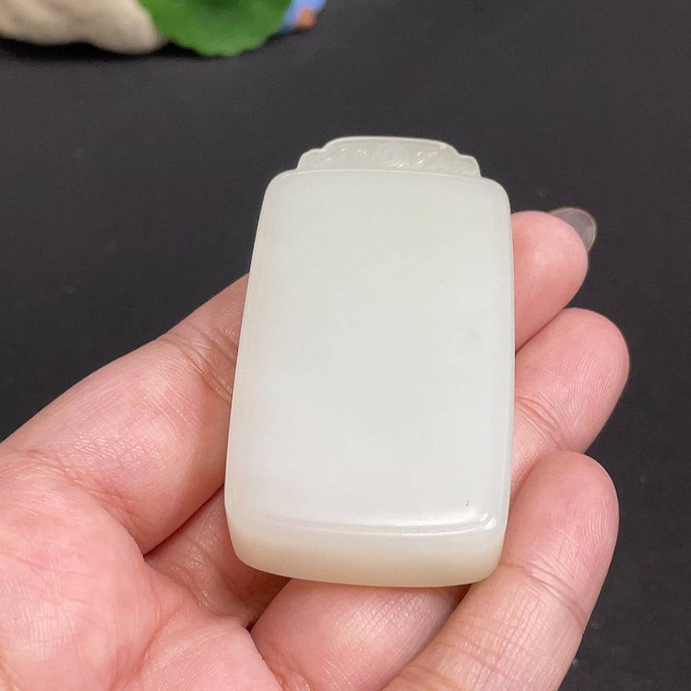Huiliu certified Hetian jade pendant featuring a plain, smooth jade stone, showcasing elegant craftsmanship and natural green color.
