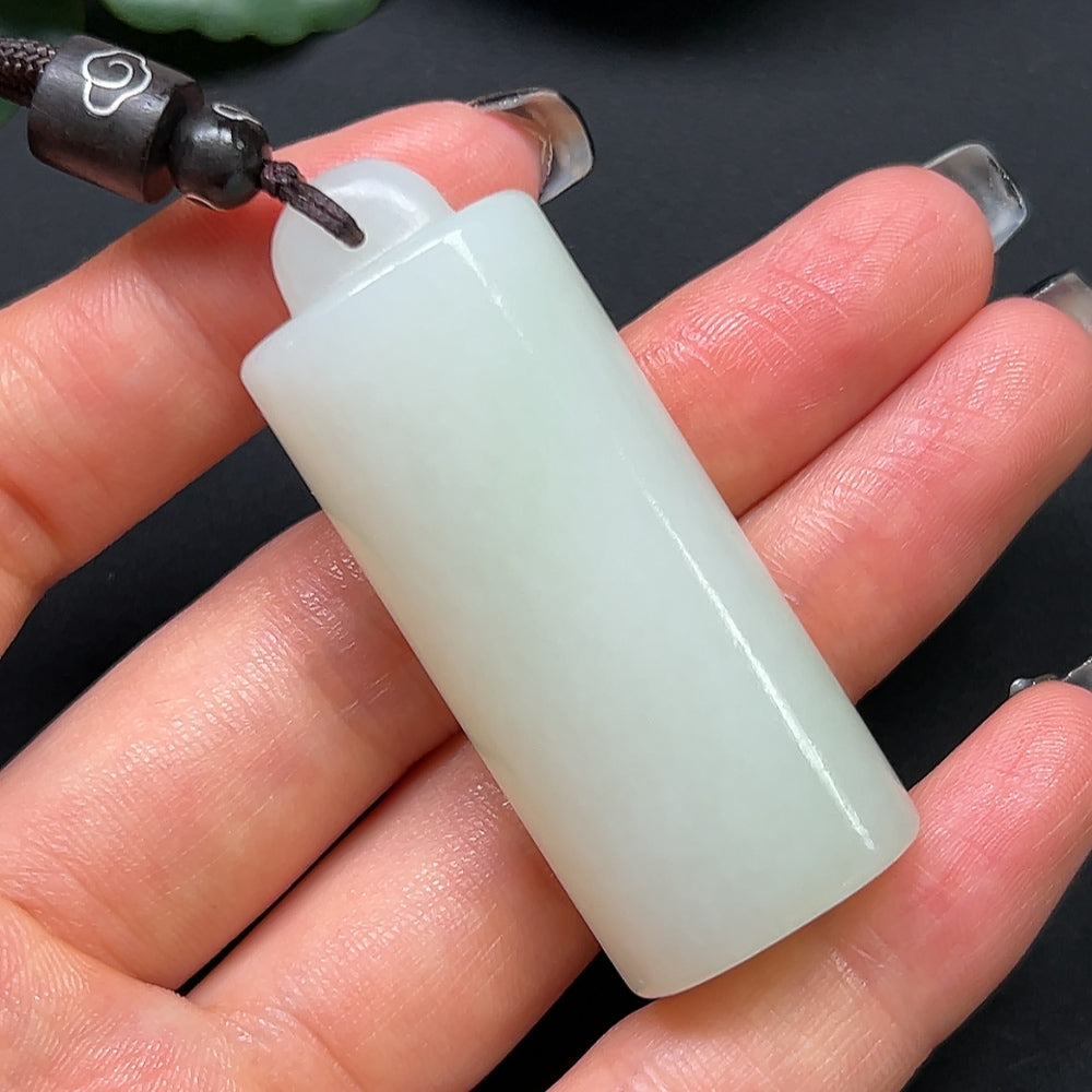 HKHQ Hetian Jade bamboo tube pendant necklace with rope, weighs approximately 38.6g, featuring a smooth green jade design.