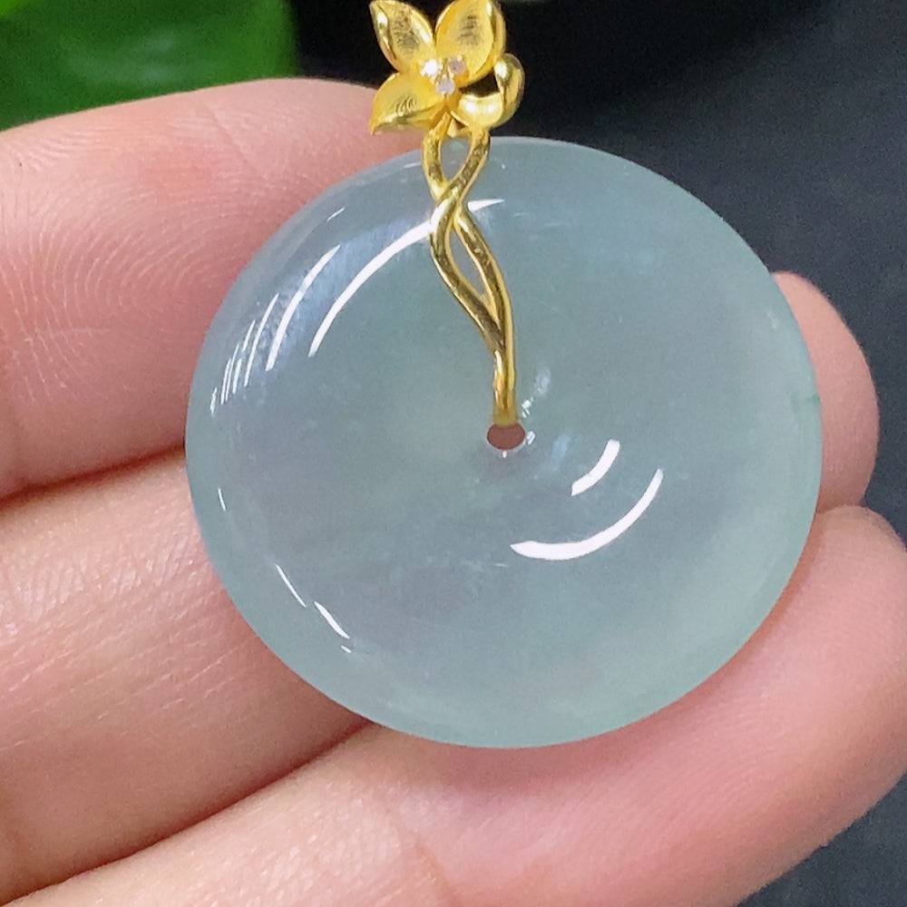 Jadeite pendant with peace knot design, 18K gold accents, diamond details, from HUILIU HQ, showcasing the intricate jewelry piece.
