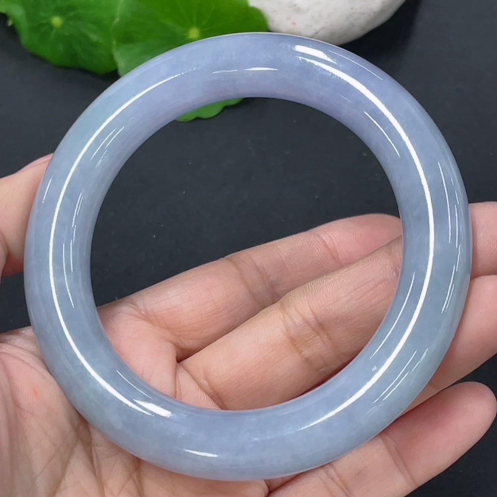 HUILIU HQ jadeite round bangle in size 56, weighing approximately 72.67g, crafted from smooth, polished jadeite material.