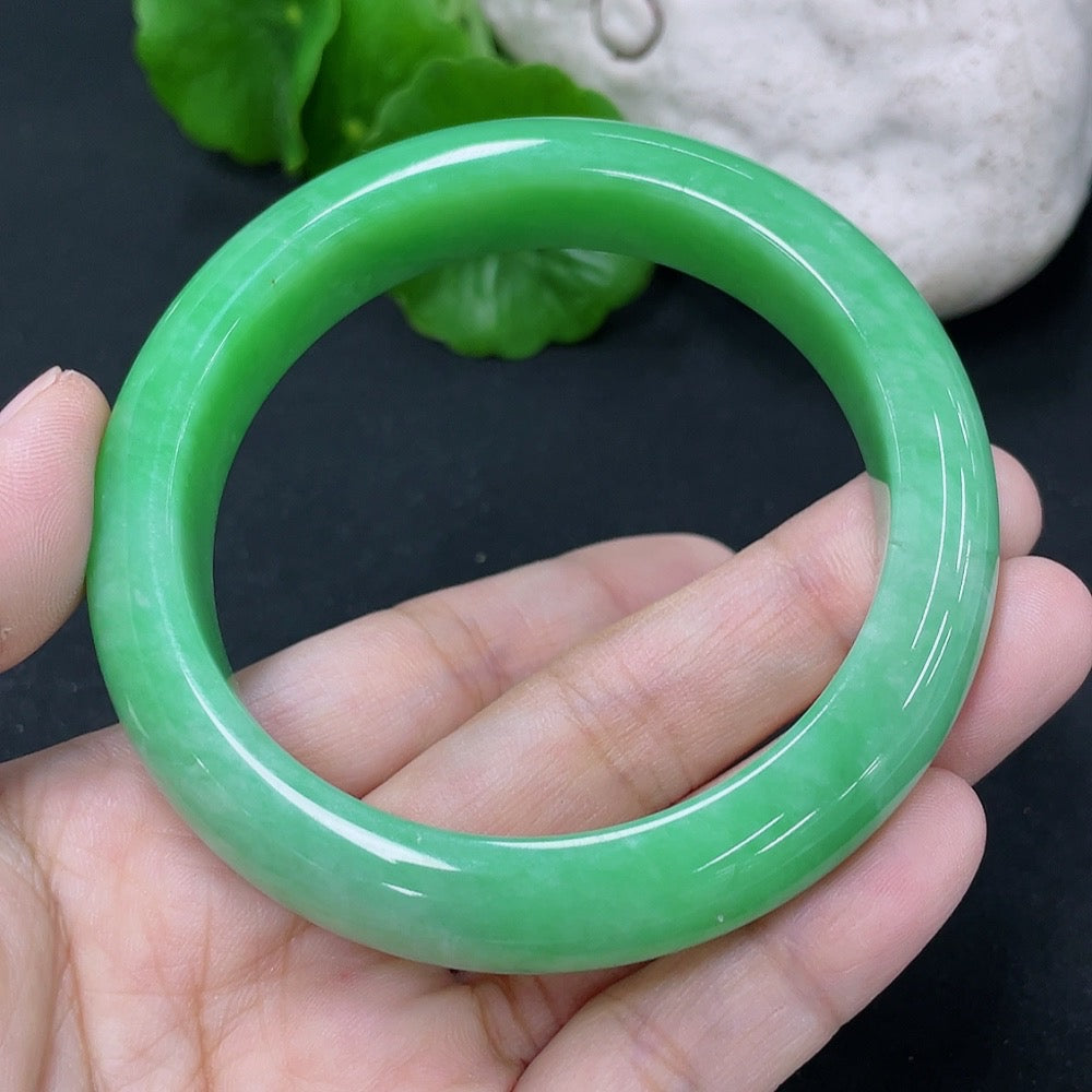 HKHQ jadeite round bangle in size 55.8 with a smooth, polished surface and a weight of 65.83g, showcasing elegant craftsmanship.