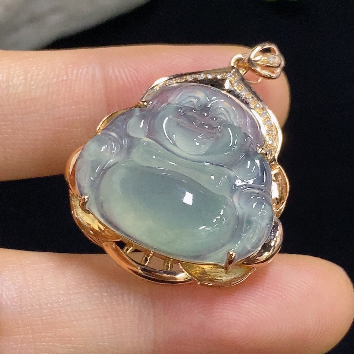Jadeite Buddha pendant with 18k gold and diamond accents, displayed on a neutral background, showcasing intricate craftsmanship.