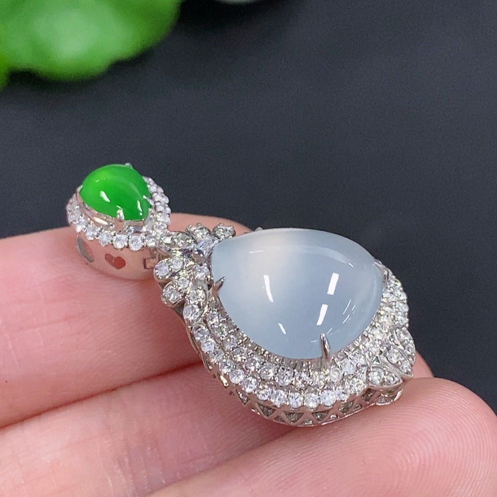 Jadeite water drop pendant necklace by HKHQ featuring 18K gold and diamond accents, showcasing a smooth, polished jadeite drop.