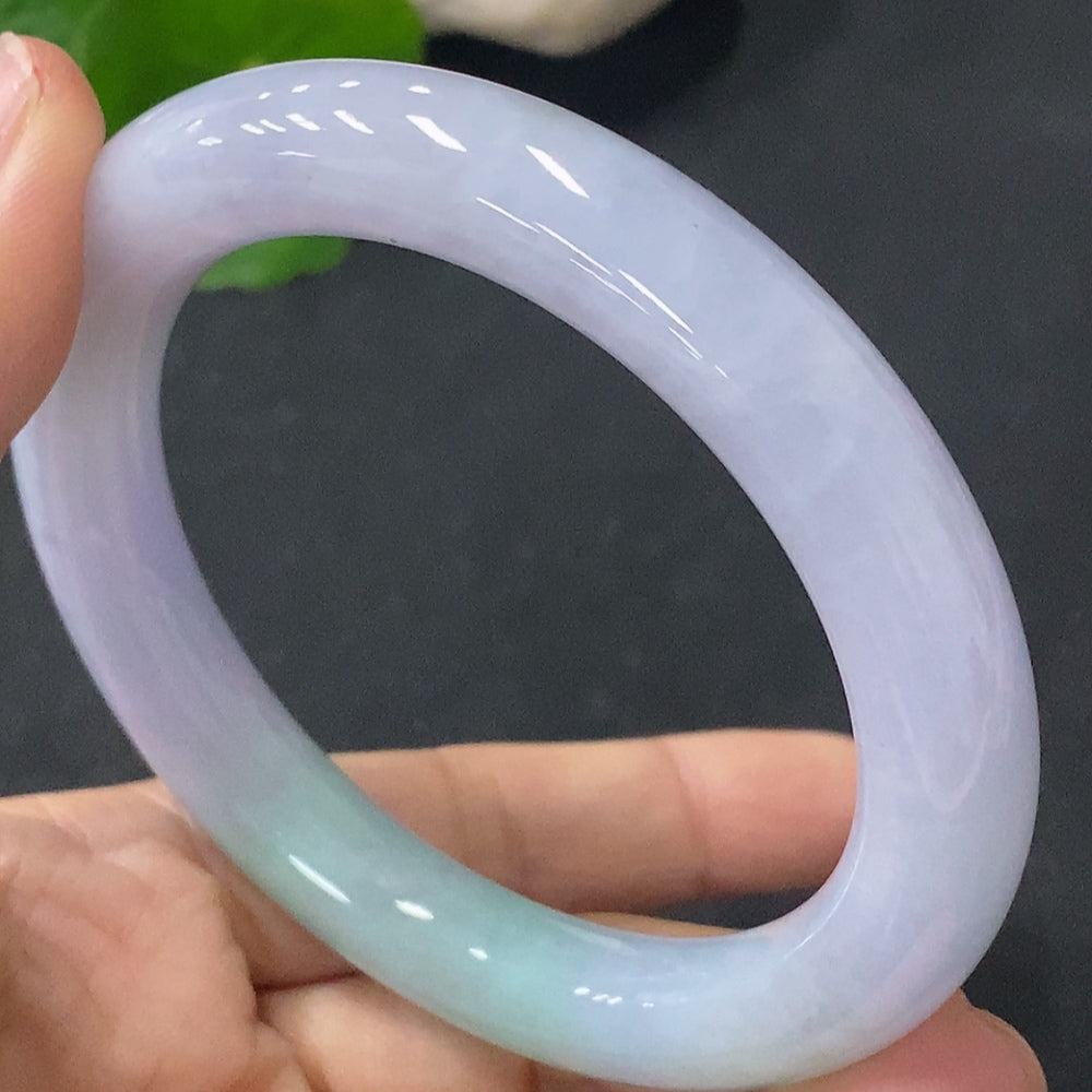 Jadeite round bangle by HUILIU HQ, 58g weight, size 55.6, smooth green jade bracelet on a neutral background.