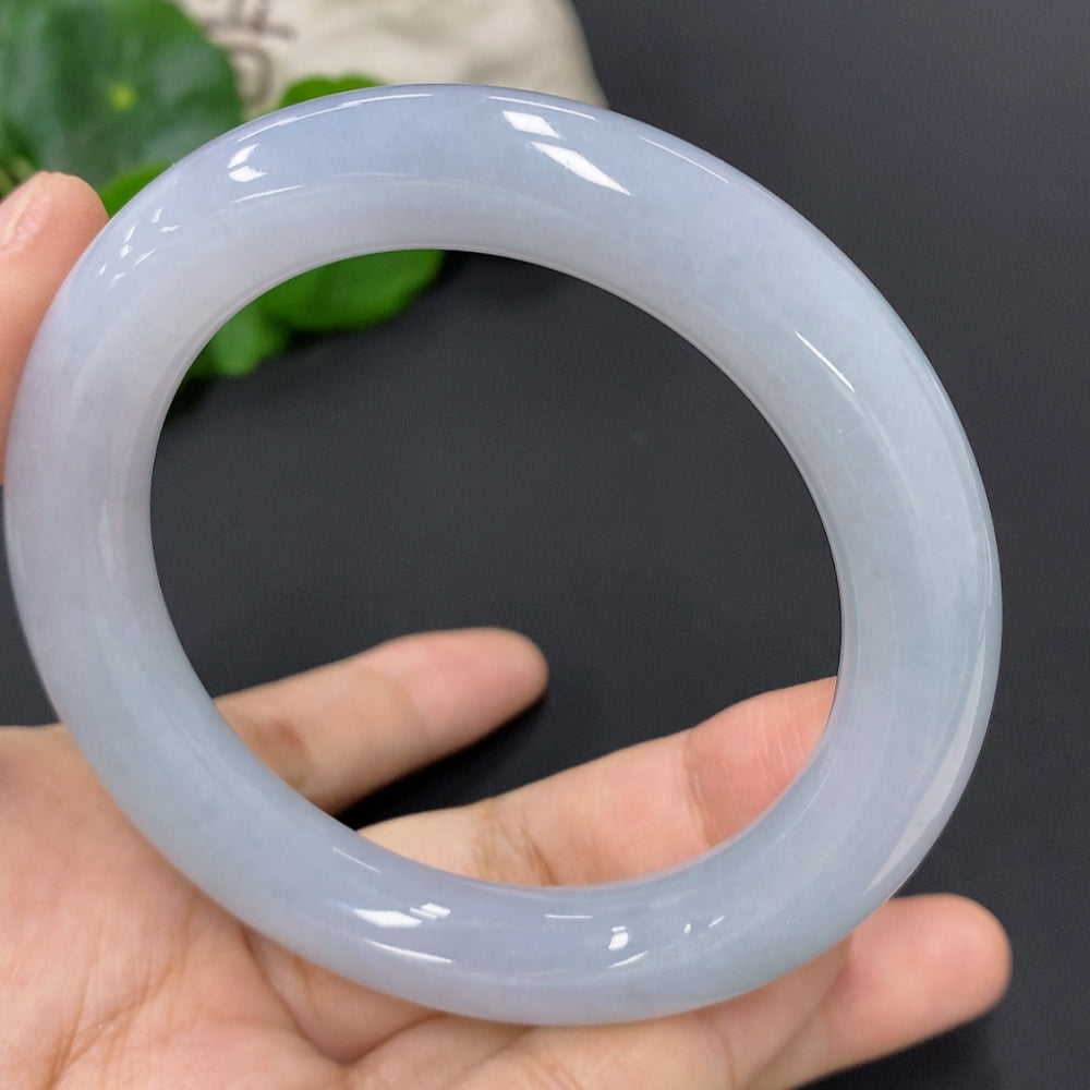 Huiliu Certified Jadeite round bangle showcasing smooth, polished green jade with a glossy finish on a plain background.