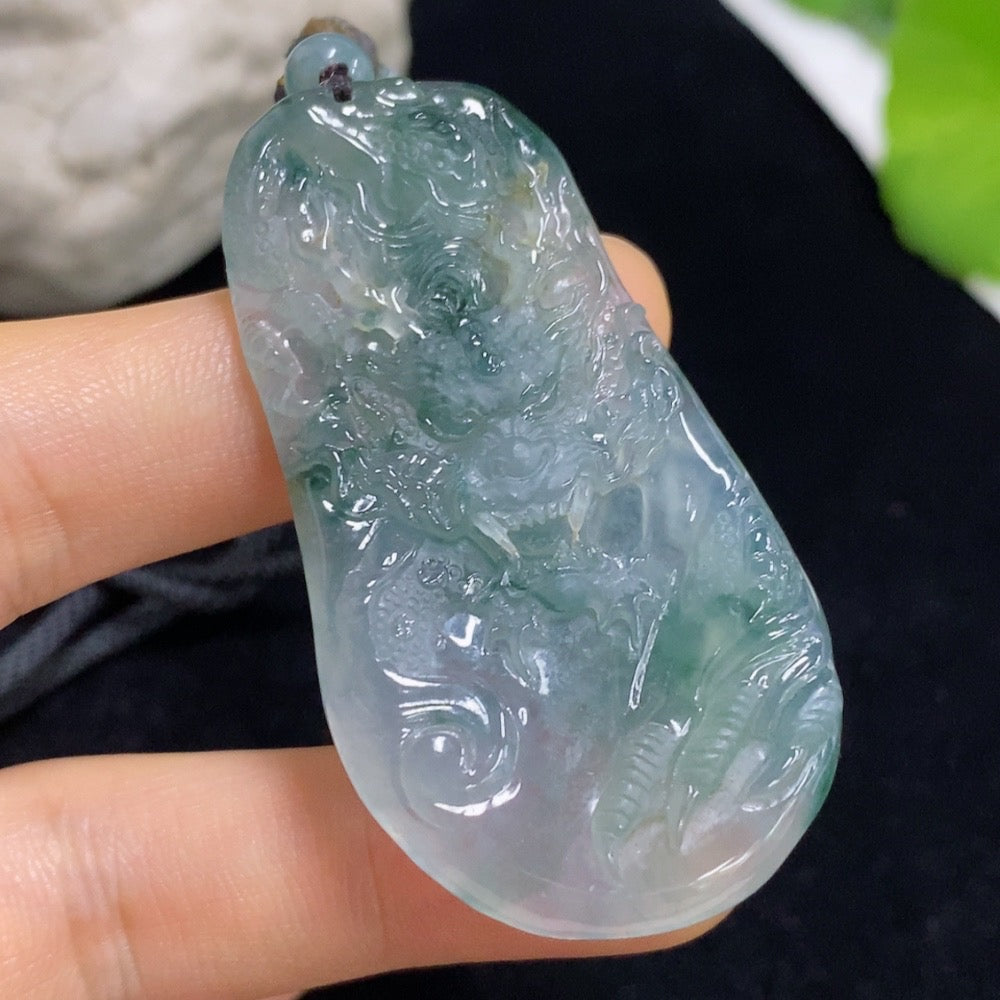 Jadeite dragon pendant with detailed dragon design, weighing approximately 21.38g, suspended on a rope, from HKHQ.