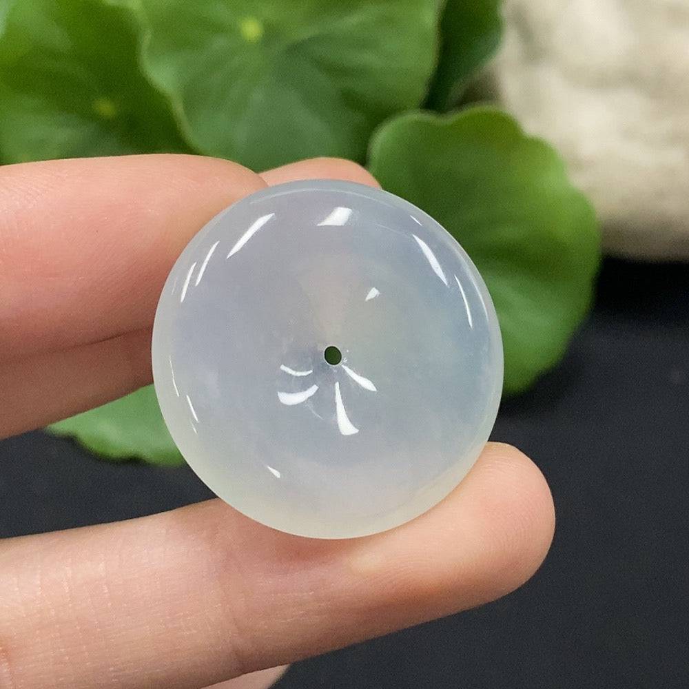 Huiliu Jadeite Safety Buckle Pendant featuring a polished jade stone, intricately crafted and certified by Huiliu HQ.
