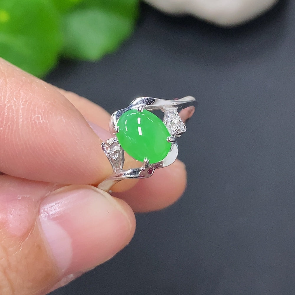 Huiliu HQ jadeite cabochon solitaire ring featuring a polished green jade gemstone on a silver band.