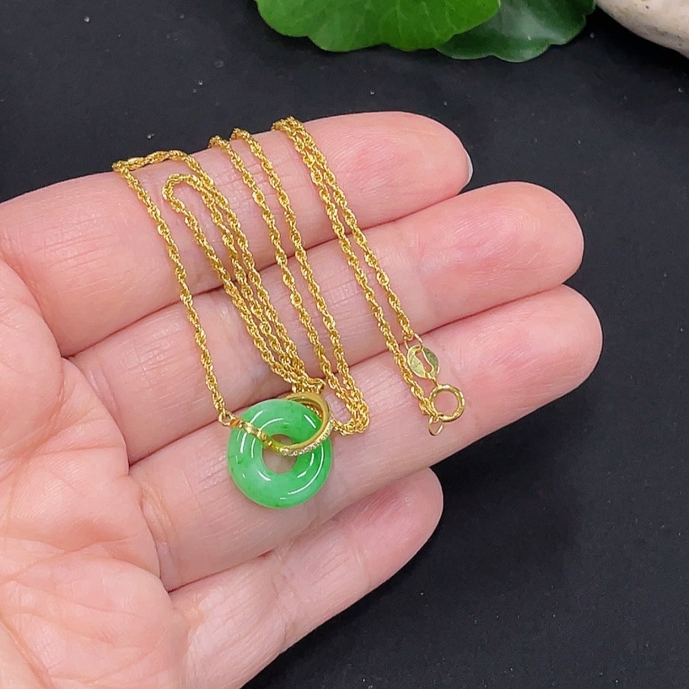 Jadeite inlaid necklace with 18K gold setting, crafted by HUILIU HQ, showcasing a delicate jade pendant on a gold chain.