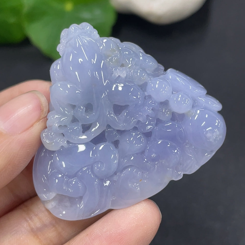 Huiliu HQ jadeite pendant featuring a polished, green jade gemstone with a smooth, rounded shape and natural stone pattern.