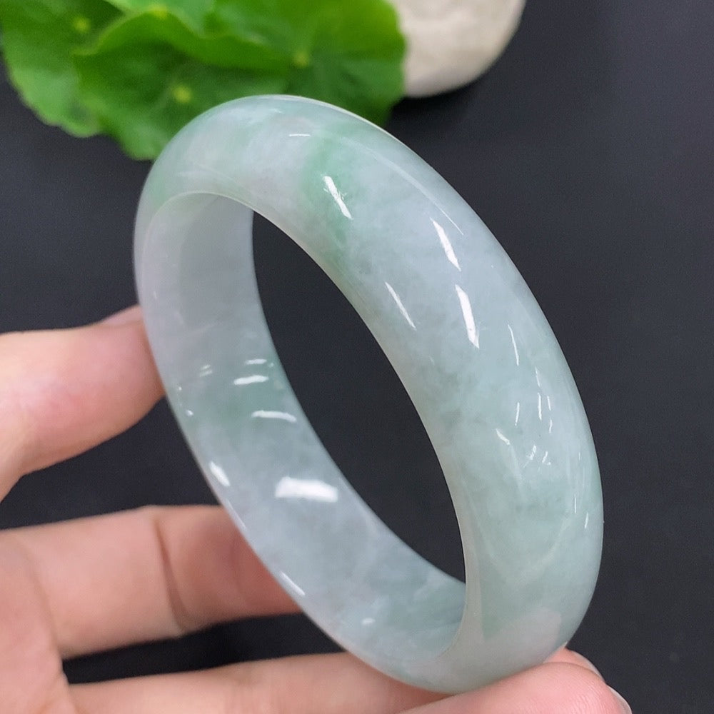 Jadeite round bangle with a total weight of 64.6g and size 54.5, featuring smooth, polished jadeite material from HKHQ.