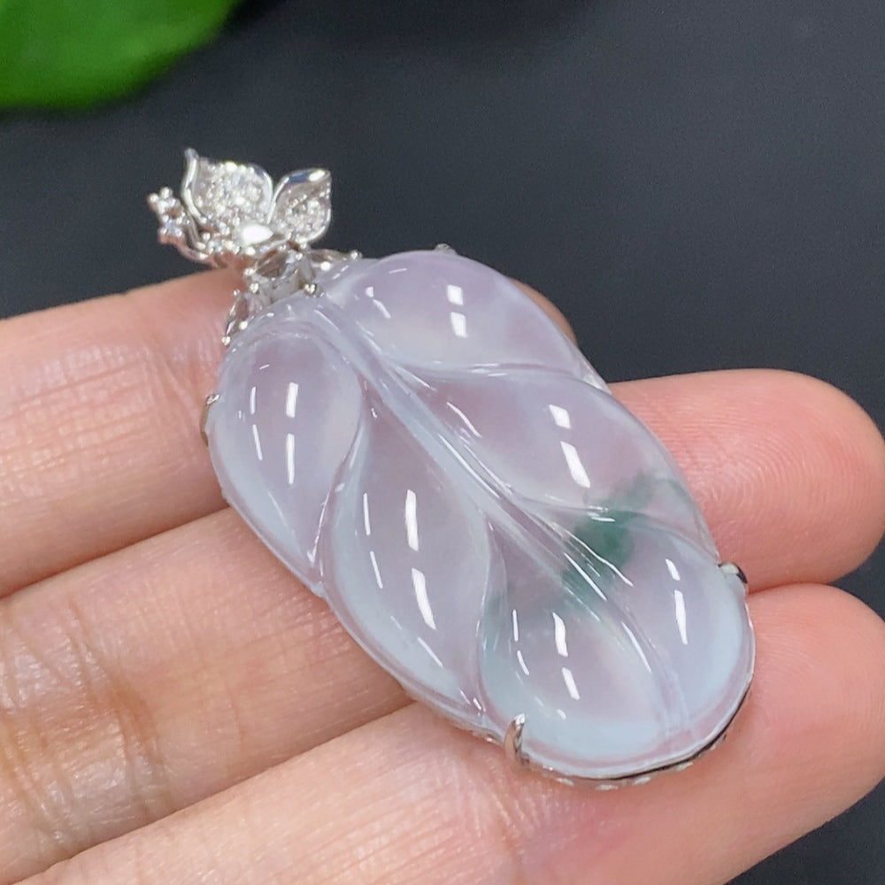 Jadeite leaf pendant necklace by HKHQ featuring 18K gold and diamond accents, showcasing a detailed green jadeite leaf design.