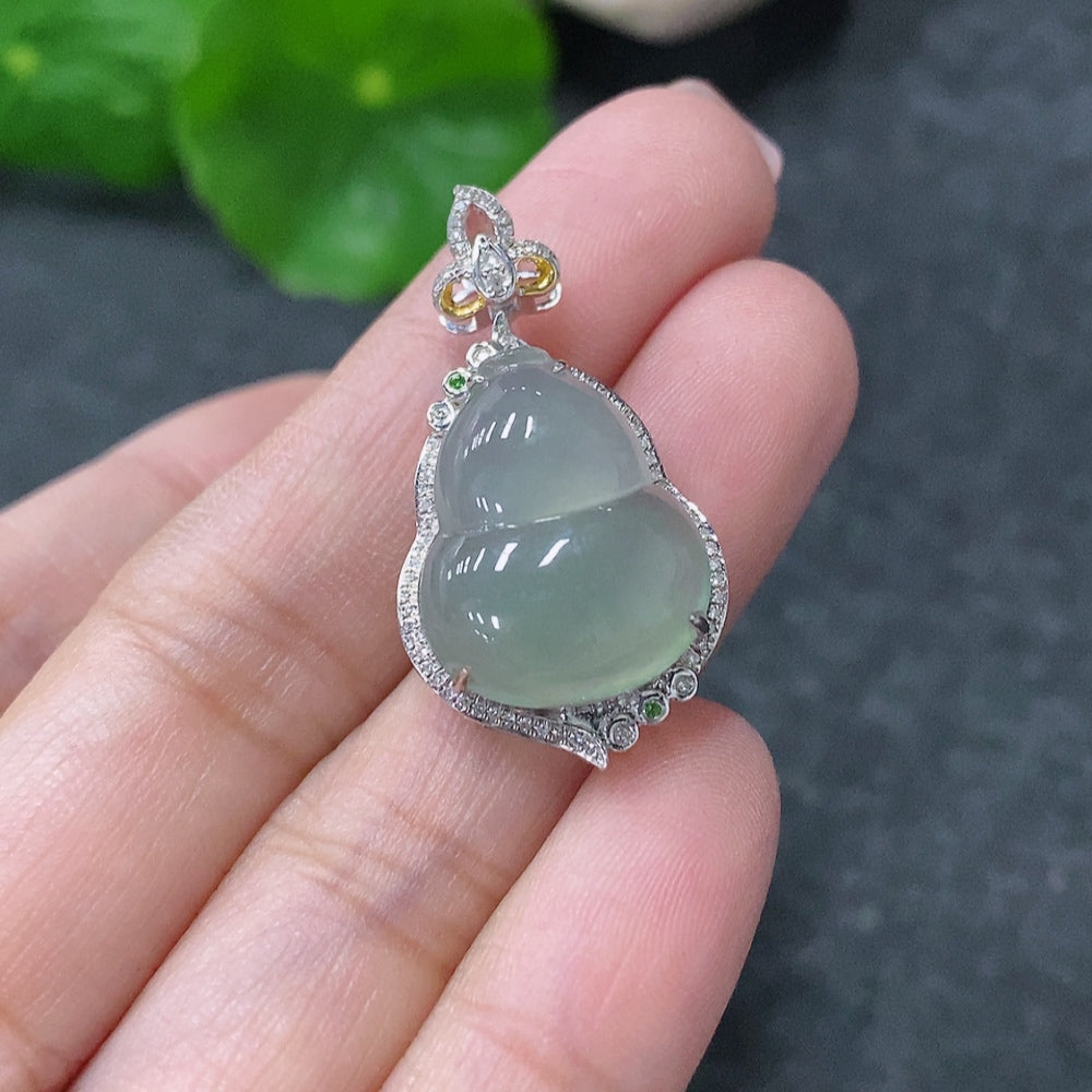 Huiliu Jadeite inlaid gourd pendant with diamond accents, showing intricate craftsmanship and vibrant green jade color.