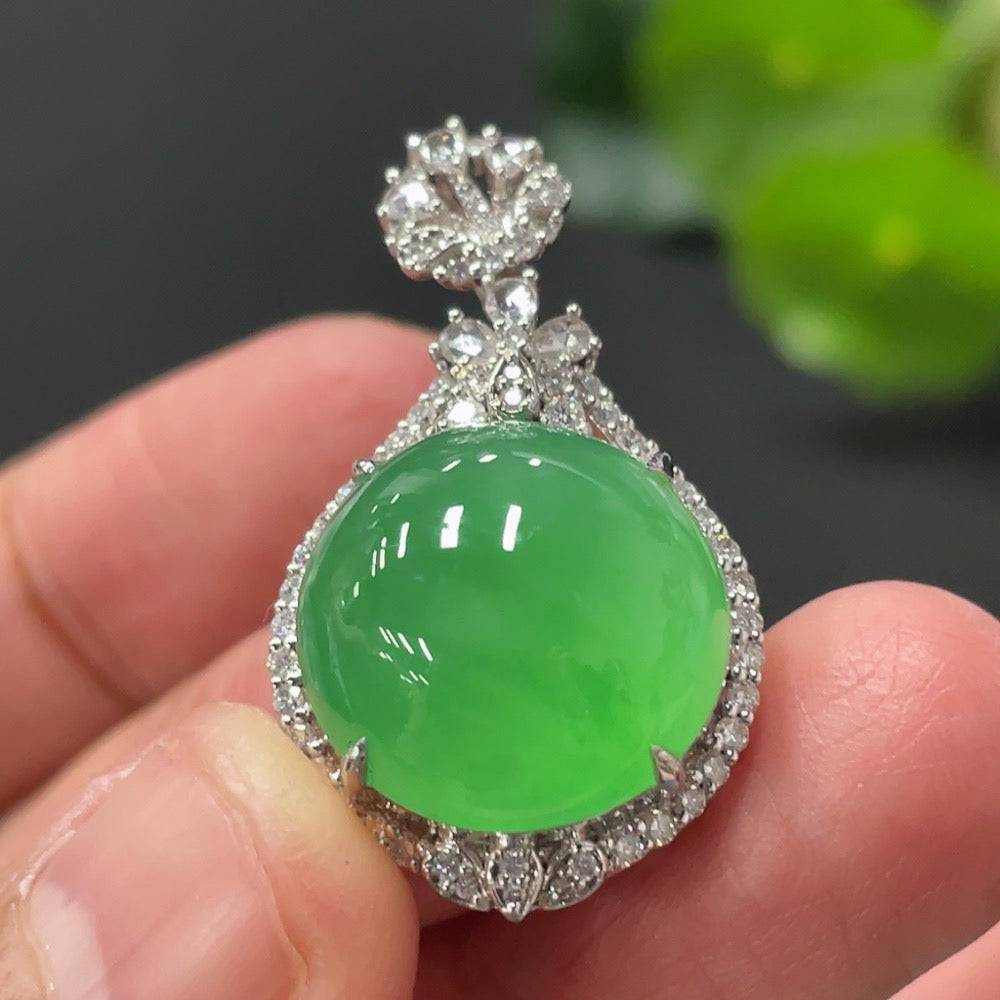 Jadeite cabochon pendant with 18K gold setting and diamond accents, featuring a polished green jade stone, by HUILIU HQ.