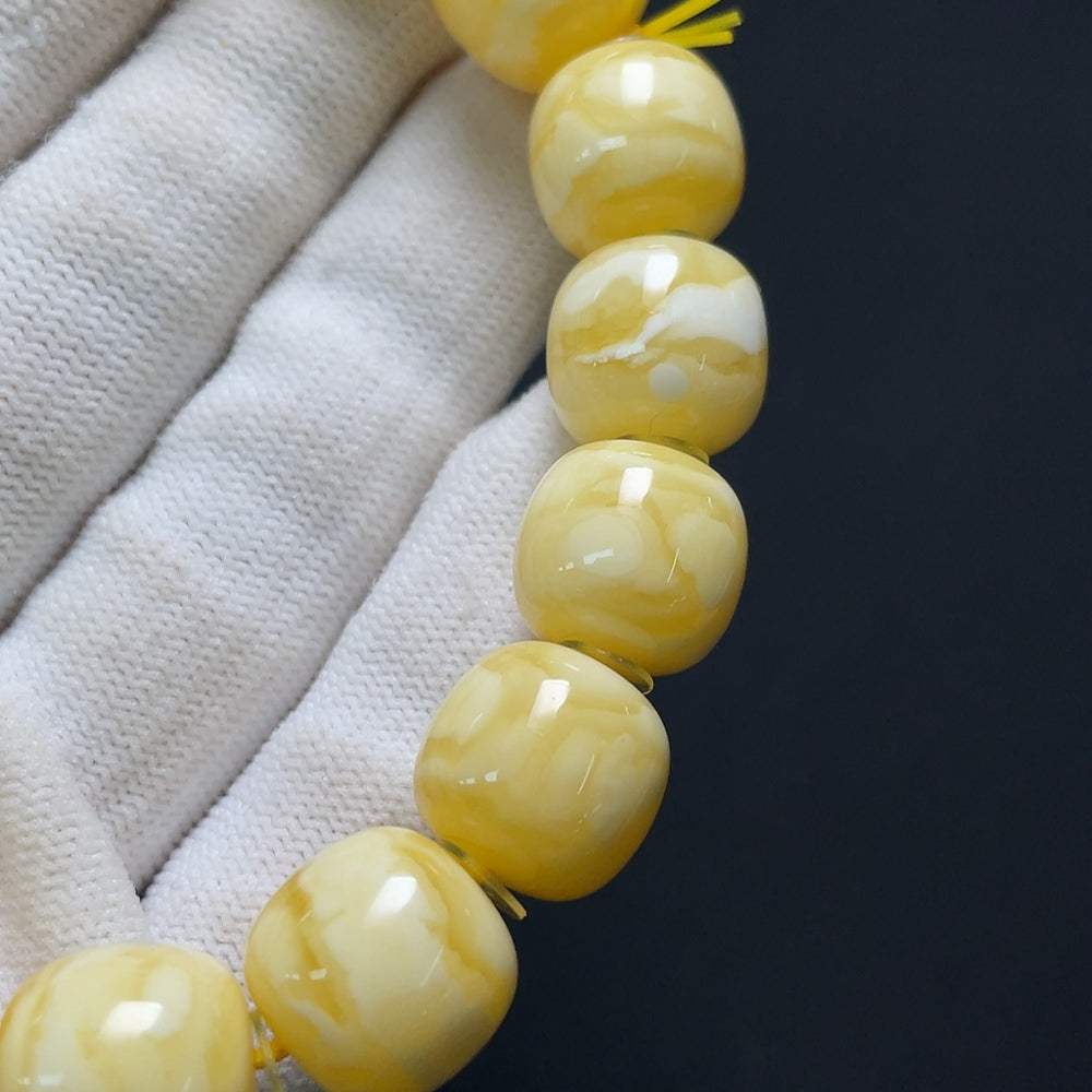 Amber beeswax bracelet by HKHQ featuring warm amber beads and a natural, handcrafted design.