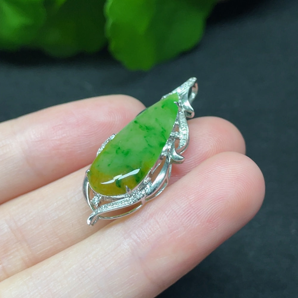 Jadeite teardrop pendant with 18K gold setting and diamond accents, elegant necklace by HKHQ showing detailed craftsmanship.