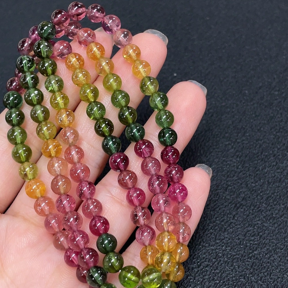 HKHQ tourmaline bead strand necklace with vibrant multicolored round beads on a delicate string.