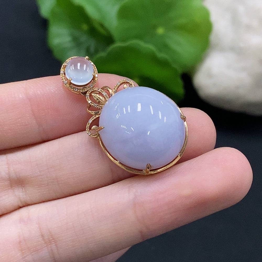 HUILIU HQ jadeite cabochon pendant set in 18K gold with diamond accents, showing the elegant jewelry on a white background.