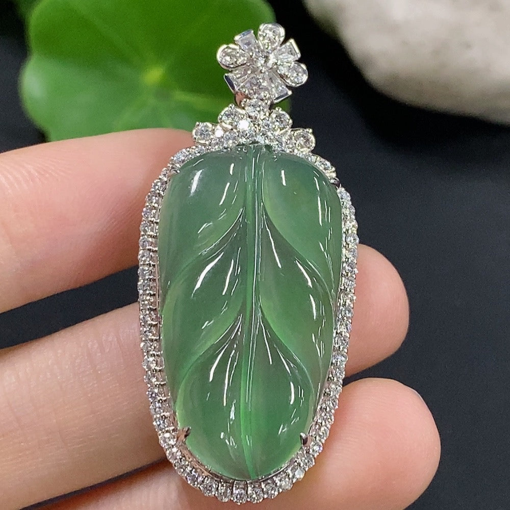 Jadeite leaf pendant in 18K gold with diamond accents, featuring intricate inlay design and a polished finish.