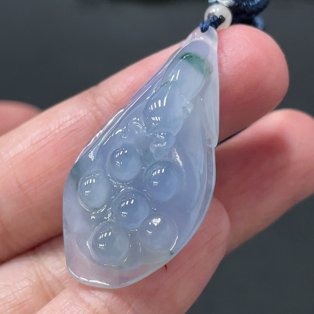 Jadeite Lotus Pod Pendant from HUILIU HQ, showcasing a polished jade pendant with intricate lotus flower design, weighing approximately 9.33g.