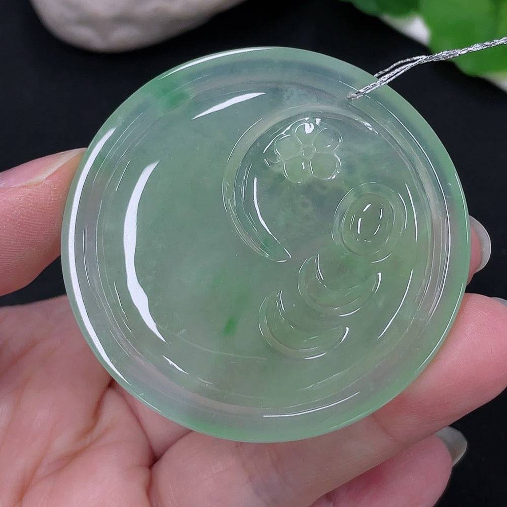 Huiliu Jadeite Guanyin pendant featuring detailed carved figure, polished jade surface, and attached cord for wearing.