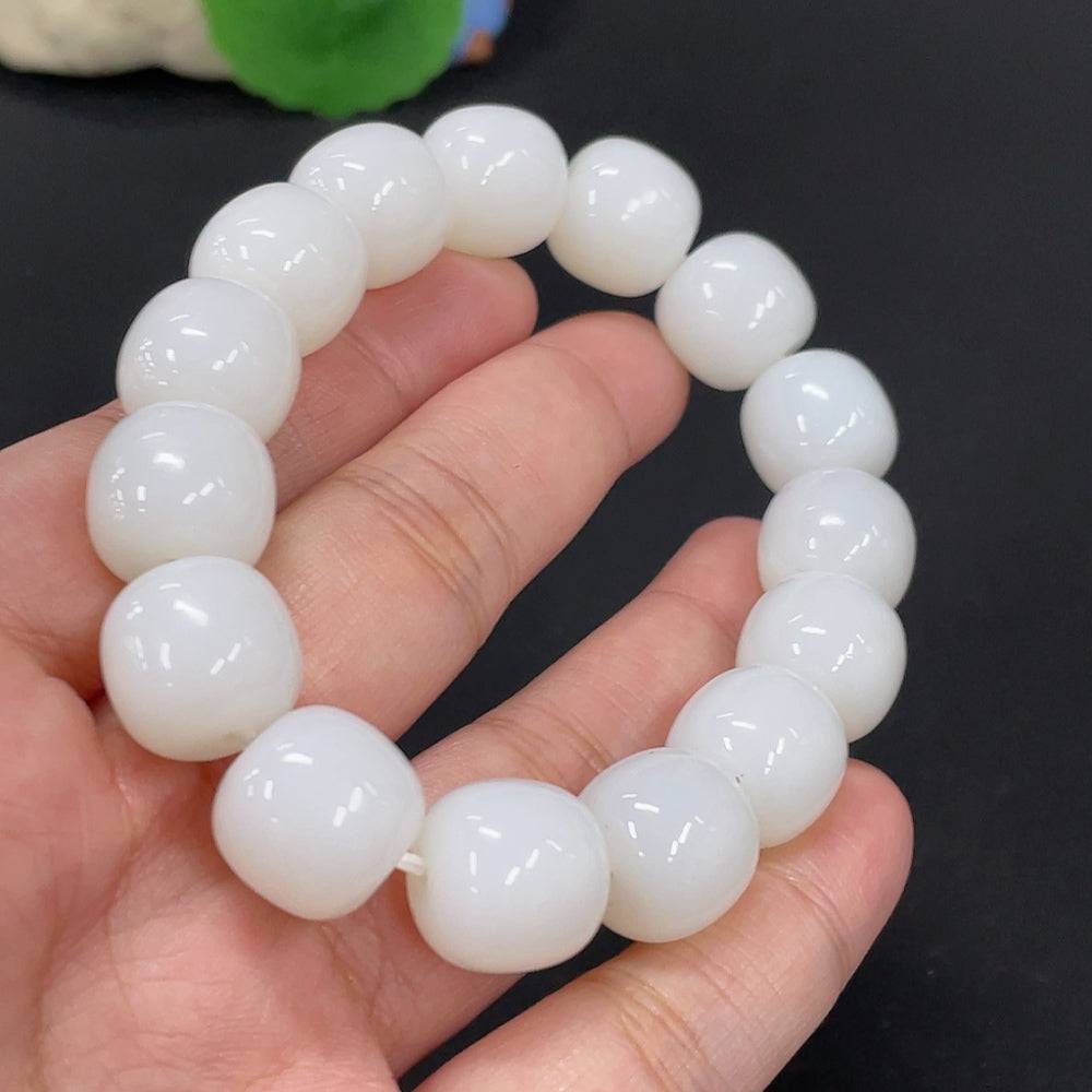 Hetian jade bracelet from HUILIU HQ featuring 13.8mm beads, weighing approximately 70g, showcasing smooth, polished jade stones.