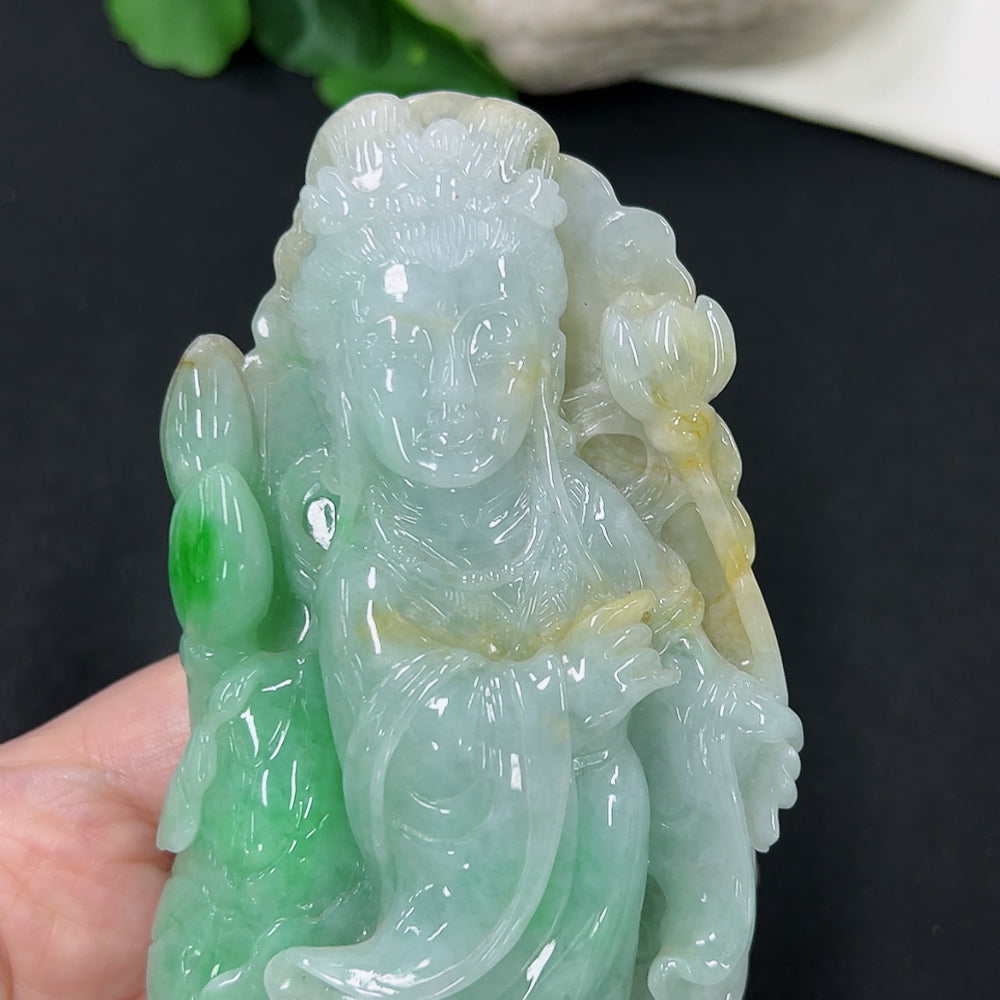 Jadeite He Xiangu jewelry ornament with intricate carvings, showcasing traditional Chinese design and vibrant green jadeite.