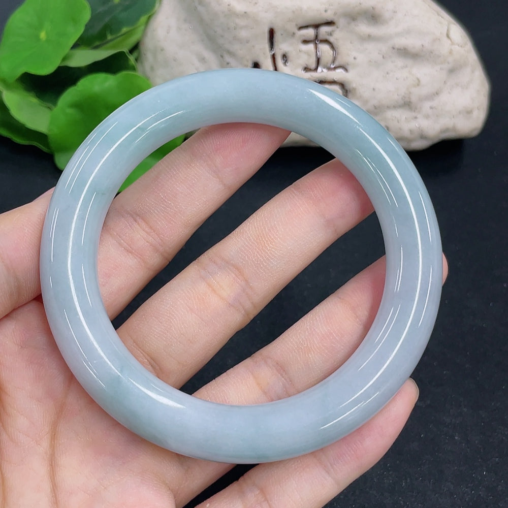 HKHQ jadeite round bangle weighing 65.9g with size 57.4, showcasing smooth, polished green jadeite surface.