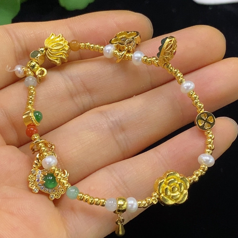Jadeite inlaid bracelet with small red beads, gold accents, tested non-gold parts, crafted by HUILIU HQ, featuring yellow and red hues.