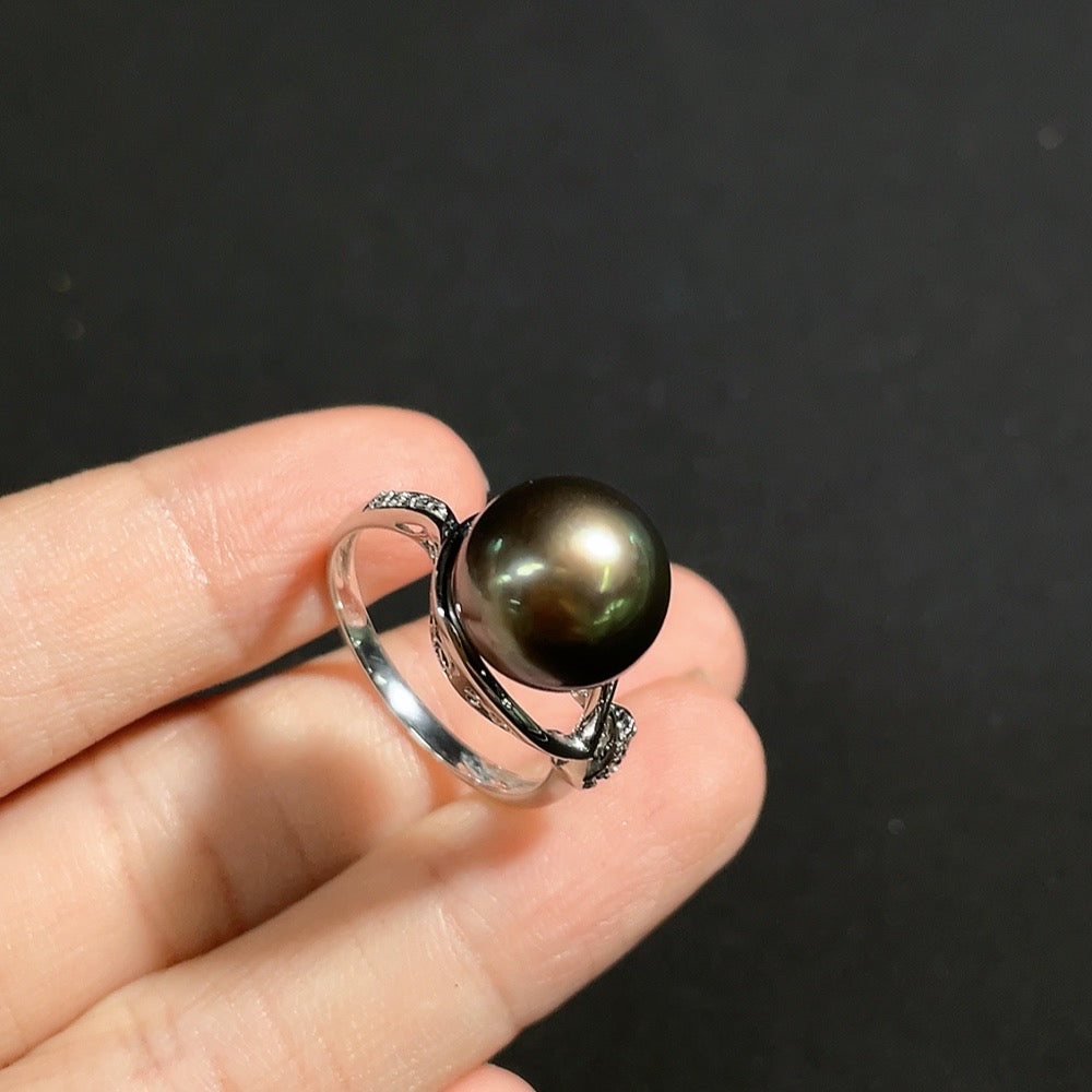 Seawater pearl ring with diamond accents in 18k gold, size 16, featuring a 10.8mm pearl and sparkling diamond details.