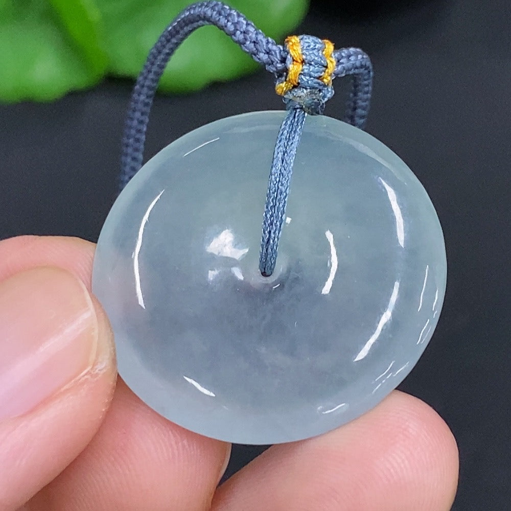 Jadeite safety pendant necklace by HKHQ featuring a smooth, polished green jadeite stone on a delicate chain.