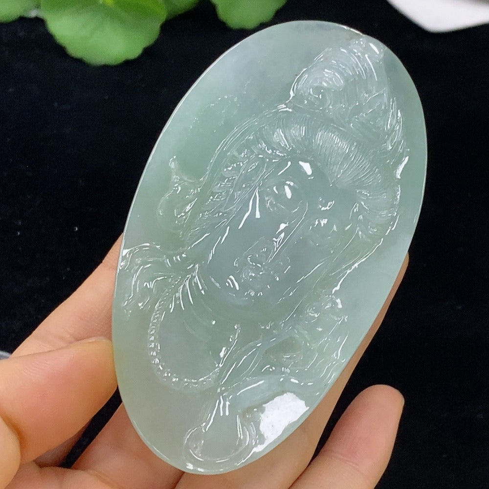 Huiliu Jadeite Guanyin pendant, approximately, showcasing detailed carved figure on smooth jade surface.