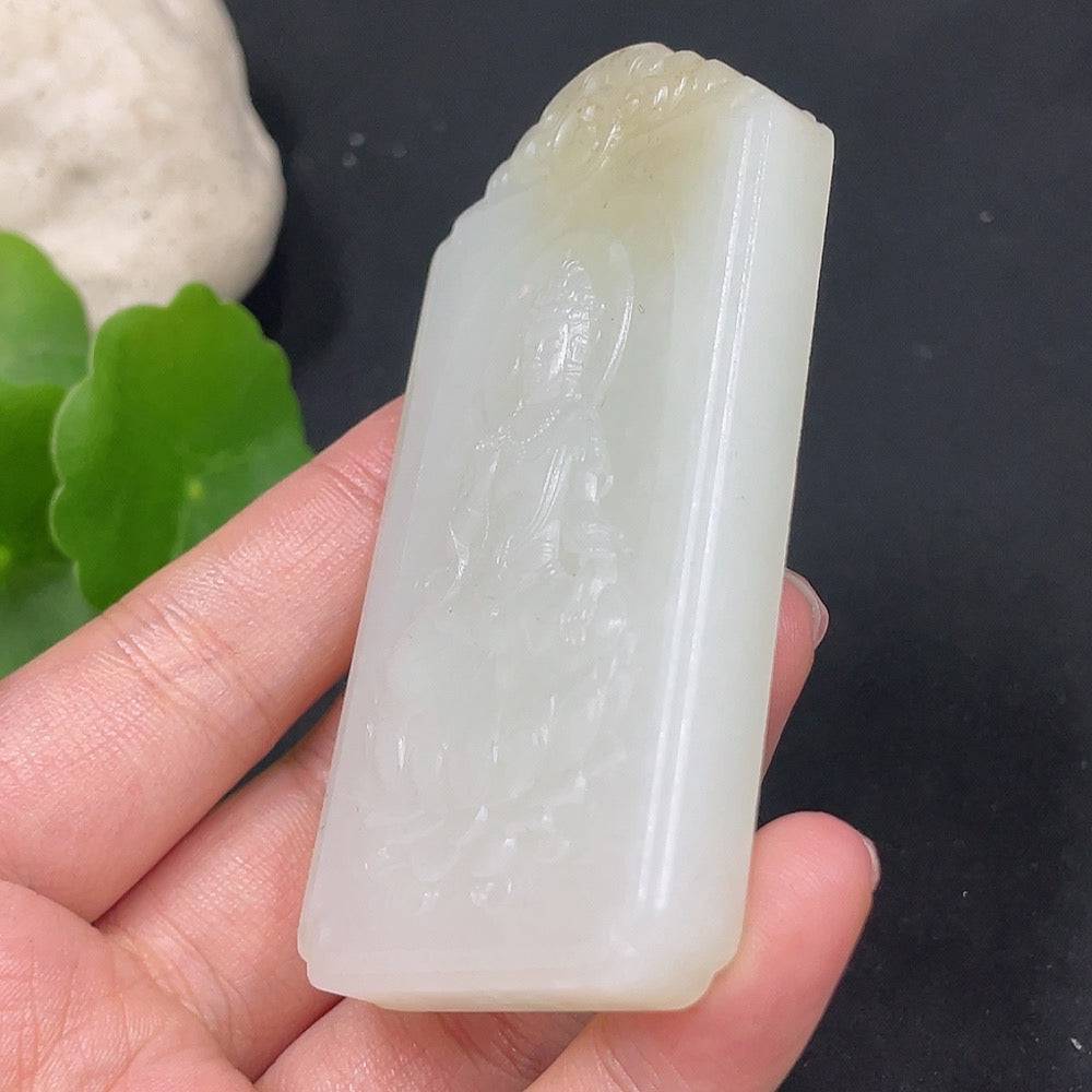 Huiliu certified Hetian jade pendant featuring Guanyin figure, intricately carved and polished for a smooth finish.