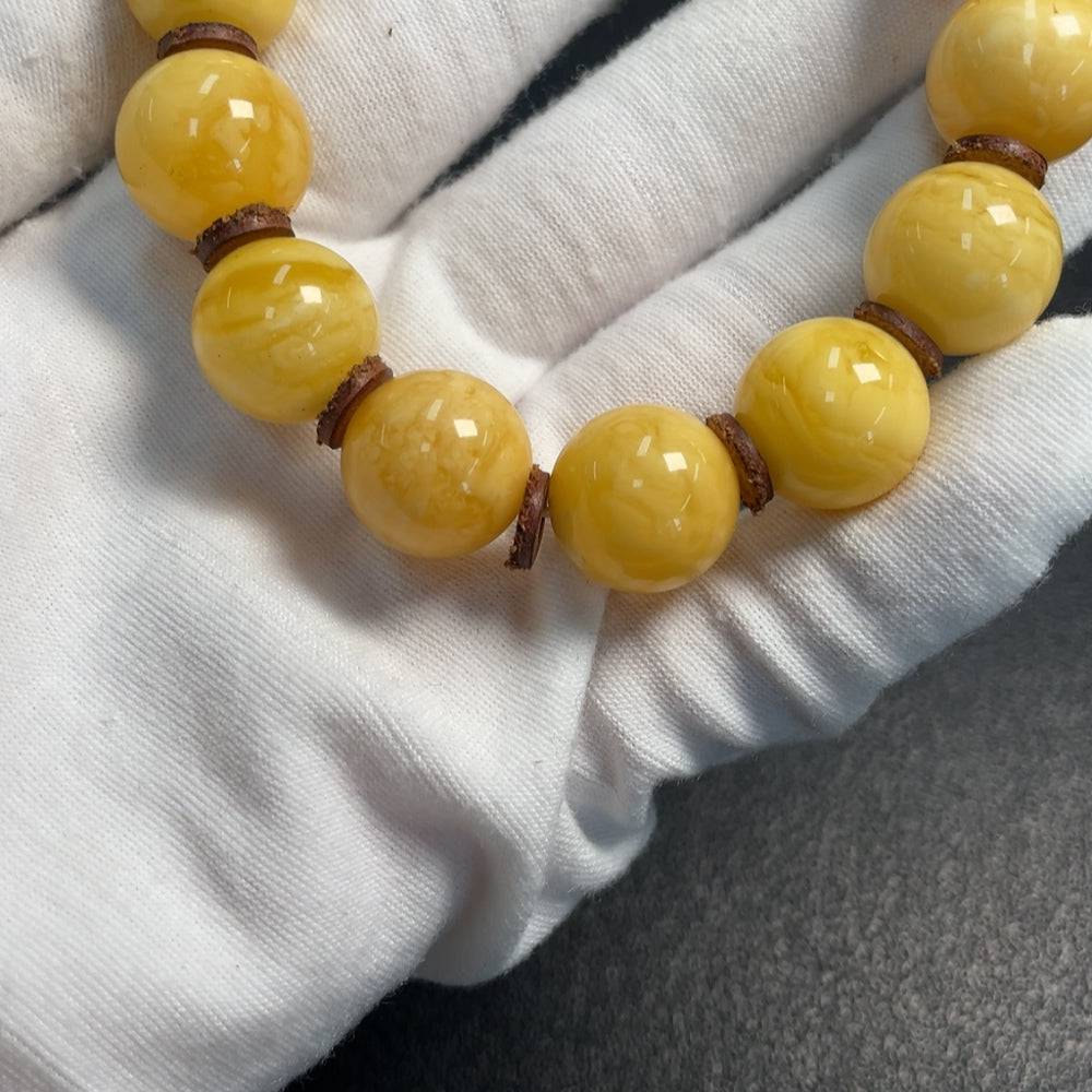 Huiliu amber beeswax bracelet with 15.6mm size beads, natural amber color, handcrafted jewelry with certified quality.