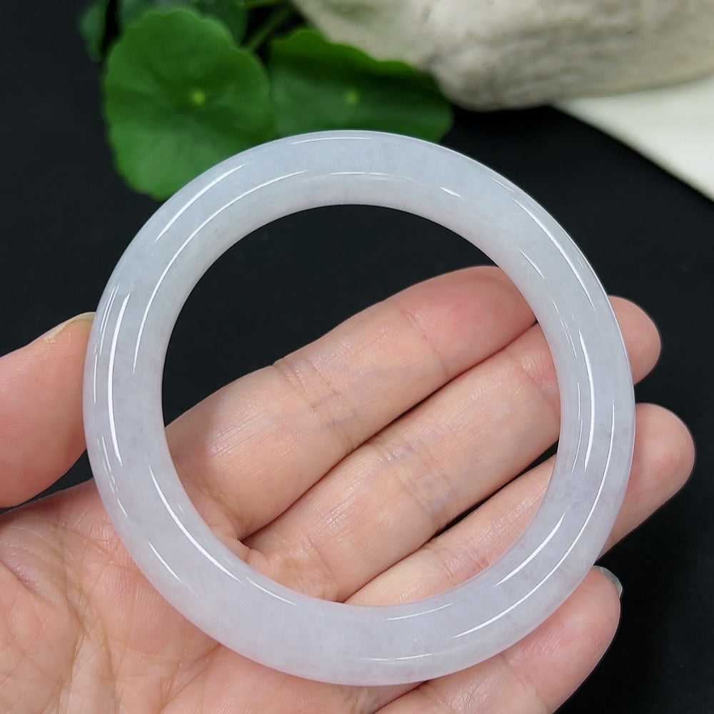 Jadeite round bangle in size 55, weighing approximately 53.33g, showcasing smooth green jade with polished finish.