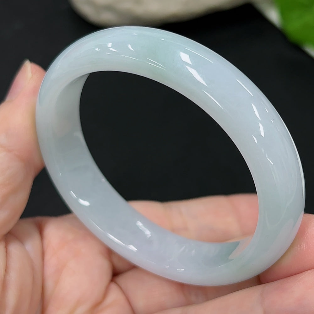 HKHQ jadeite oval bangle in size 54.6 with a weight of 44.9g, showcasing smooth, polished jadeite craftsmanship.