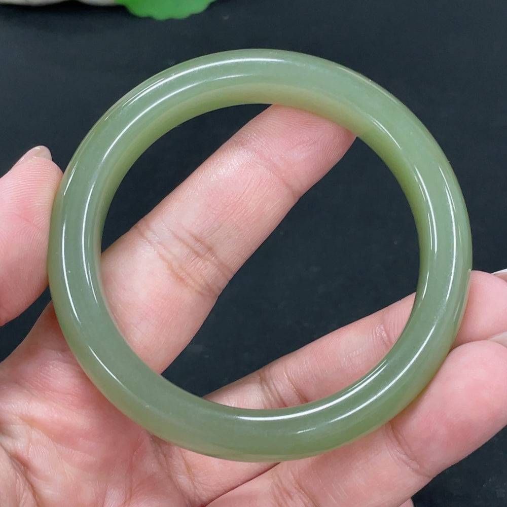 Huiliu certified Hetian jade round bracelet featuring smooth, polished jade beads on a delicate string.