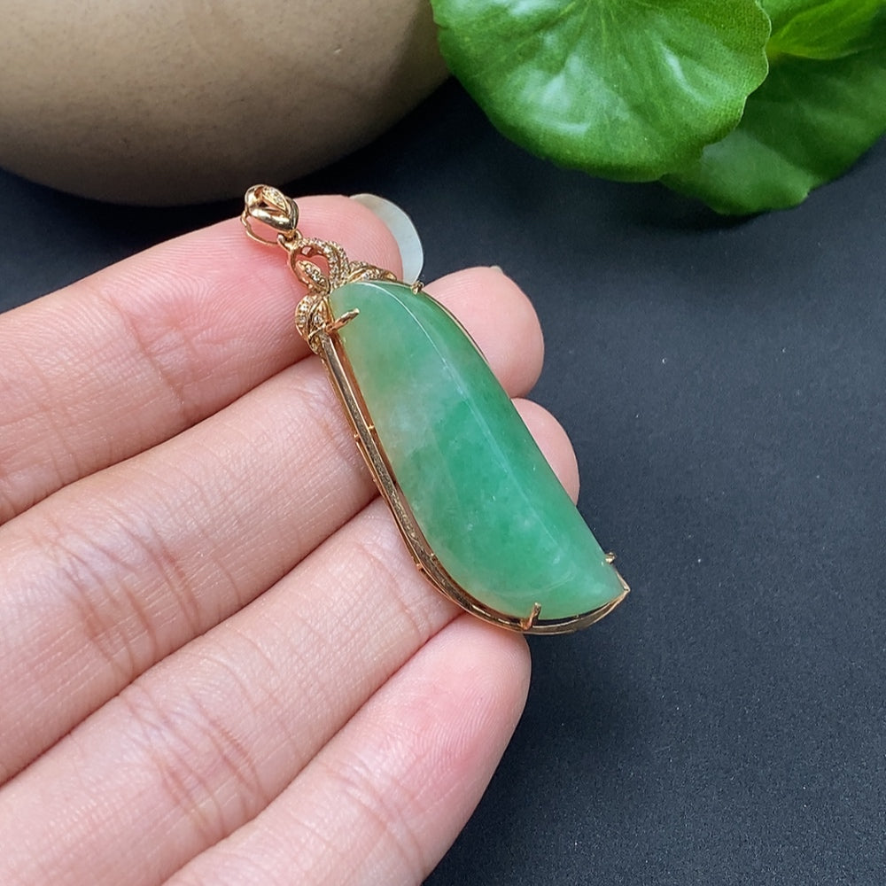 Jadeite inlaid pendant with diamond accents on an 18K necklace, featuring intricate design and elegant craftsmanship.